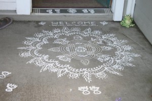 A typical rice flour kolam design at the entrance of a home.